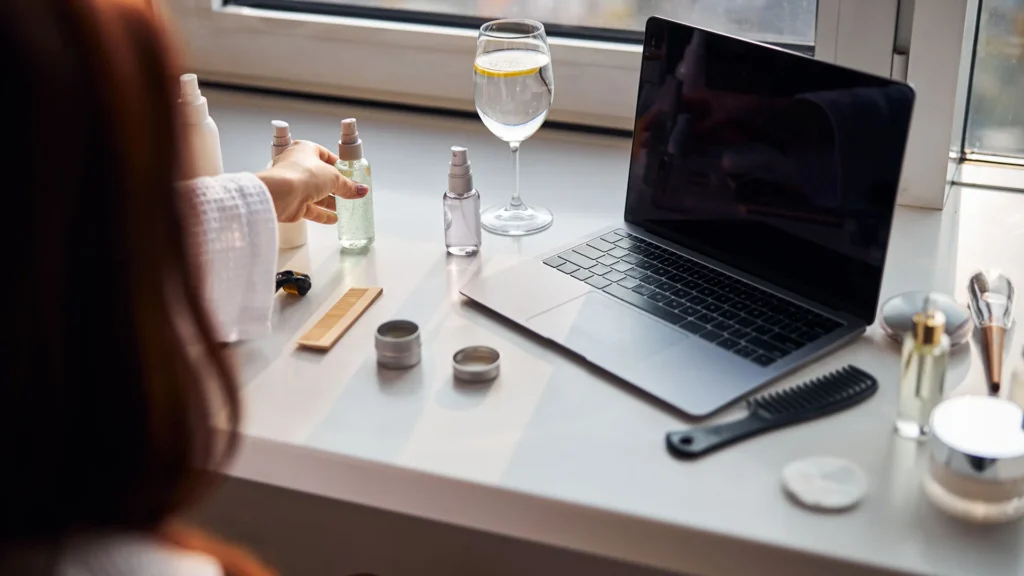 Cosmetic brand owner using laptop to access Digital Product Passport system for EU CPSR compliance