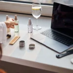 Cosmetic brand owner using laptop to access Digital Product Passport system for EU CPSR compliance