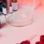 Microbiological testing of cosmetic products in a laboratory, showing petri dishes, test tubes, and scientists performing microbial analysis for UK and EU cosmetic compliance, ISO 11930, and CPSR requirements (2026).